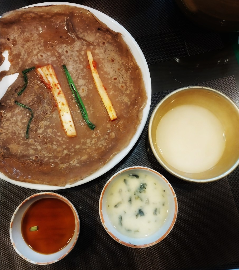 Traditional jeon and Korean soup with makgeoli
